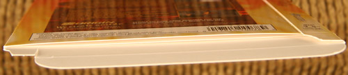 The cardboard flap on the inside of the box that holds the box contents in place